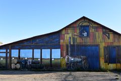 11C Mural Of The Wood Cutters On Building Wall Along Avenida Costanera Waterfront Area Of Punta Arenas Chile